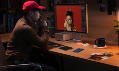 Personne avec casquette rouge travaillant sur Mac Studio
