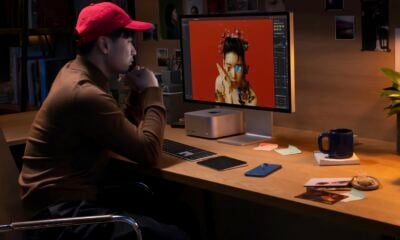 Personne avec casquette rouge travaillant sur Mac Studio