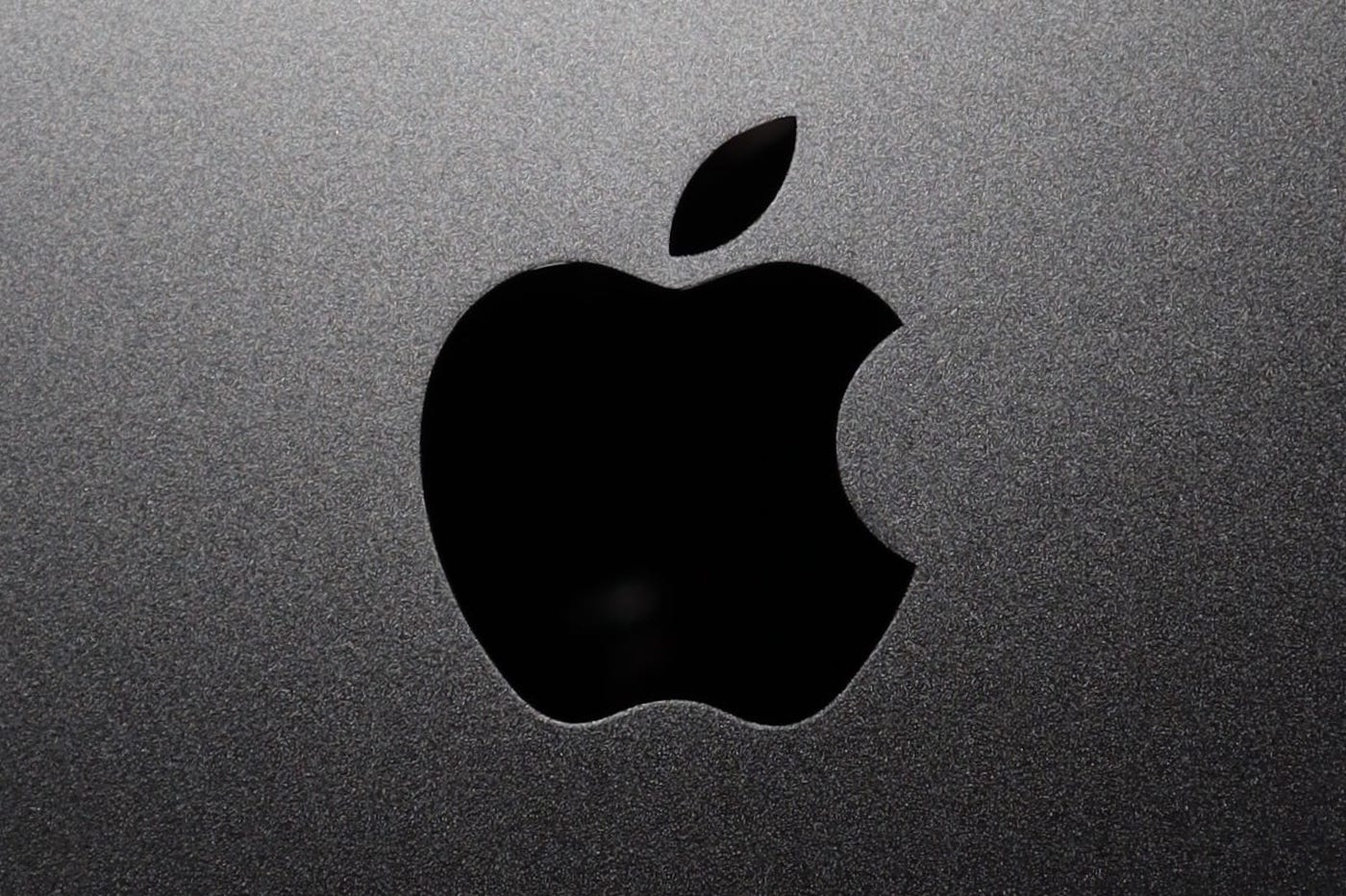 Logo Apple noir sur fond gris